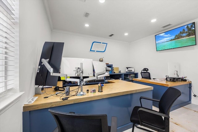 office space featuring built in desk and crown molding