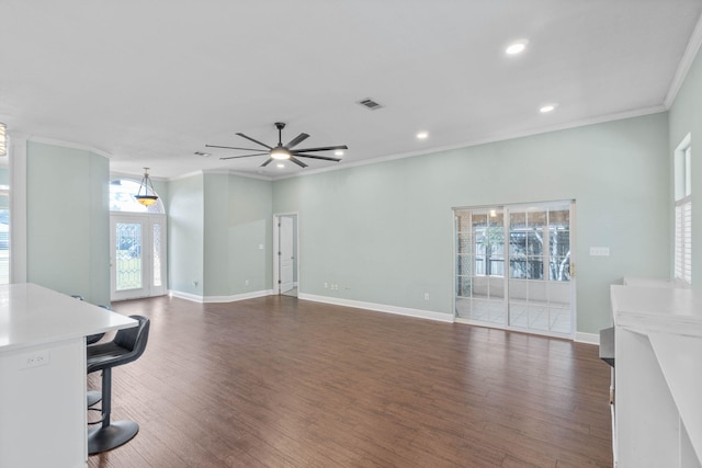 living room featuring ceiling fan, ornamental molding, and dark hardwood / wood-style flooring