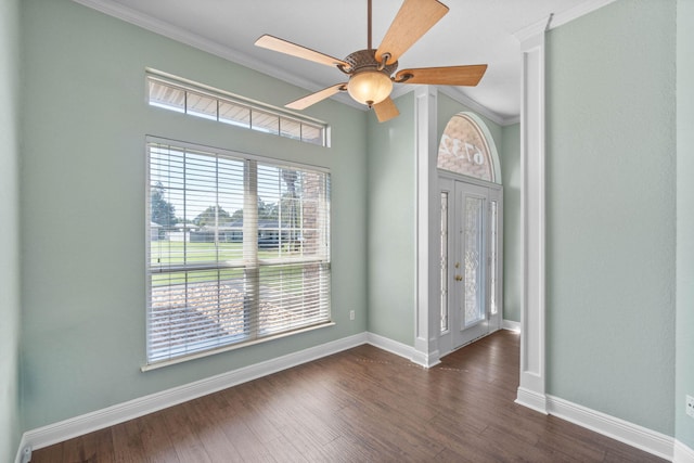 unfurnished room with crown molding, dark hardwood / wood-style flooring, and ceiling fan