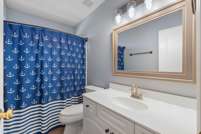 bathroom featuring vanity, a shower with curtain, and toilet