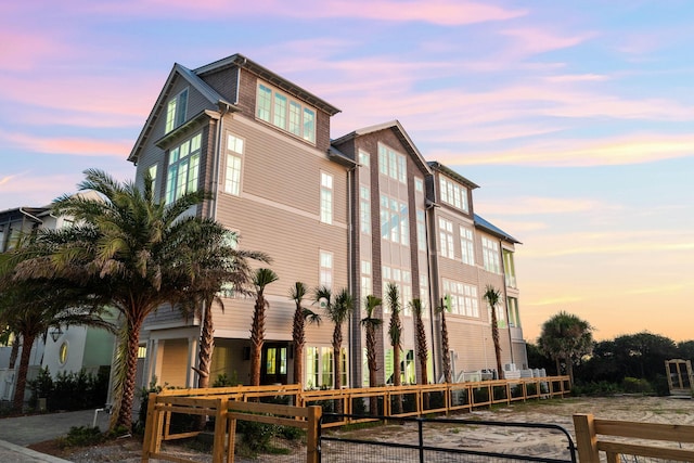 view of outdoor building at dusk