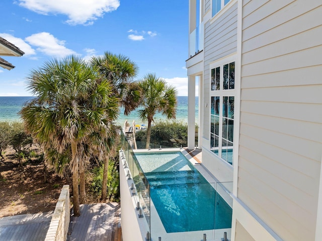 view of pool featuring a water view