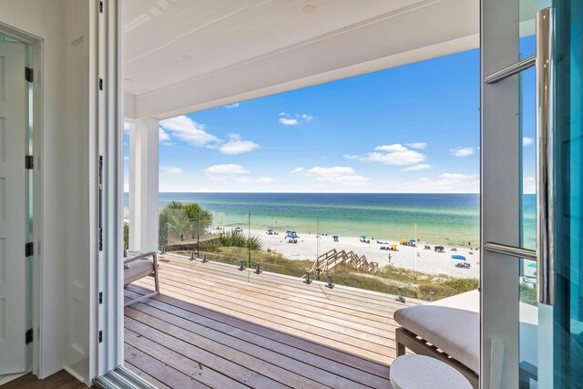 balcony with a view of the beach and a water view