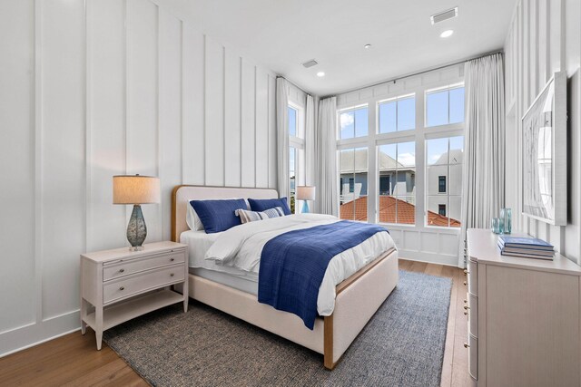 bedroom with hardwood / wood-style floors