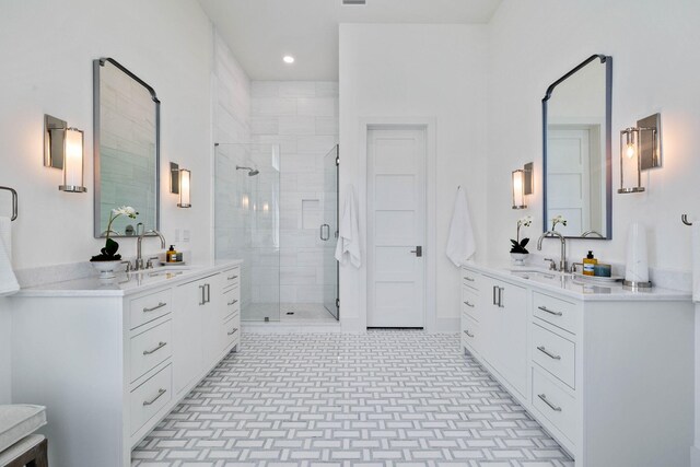 bathroom with vanity and a shower with shower door