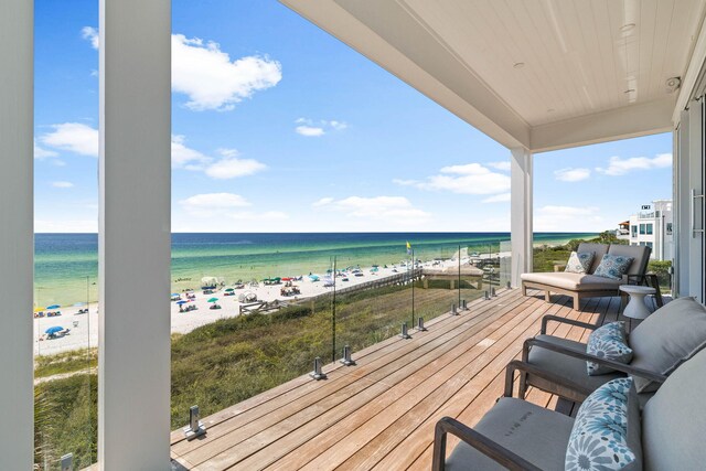 exterior space with a water view and a beach view