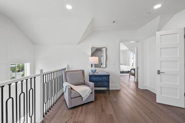 sitting room featuring vaulted ceiling and dark hardwood / wood-style floors