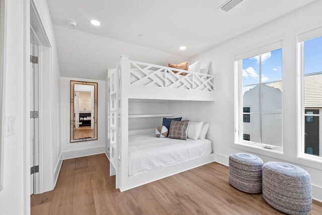 bedroom with light hardwood / wood-style floors