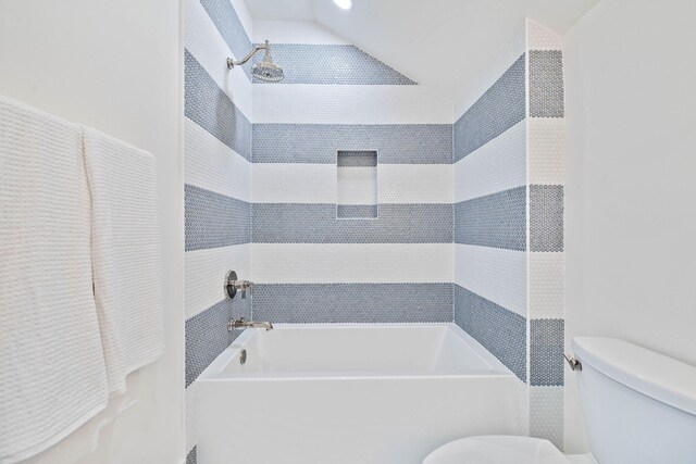 bathroom with vaulted ceiling and toilet