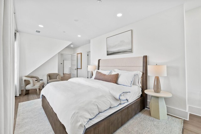 bedroom with light hardwood / wood-style floors