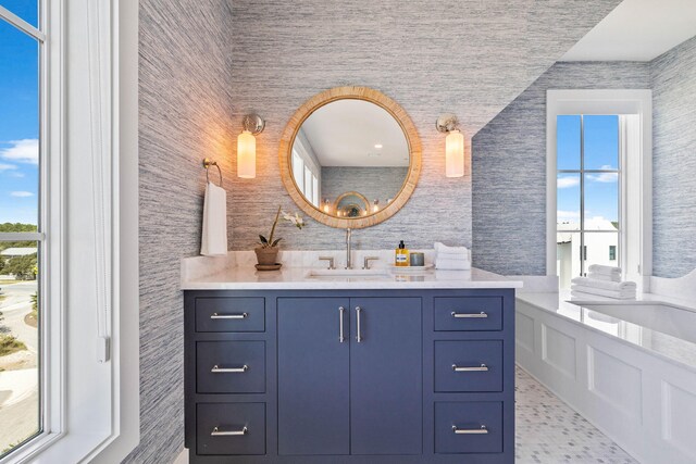 bathroom with vanity and a healthy amount of sunlight