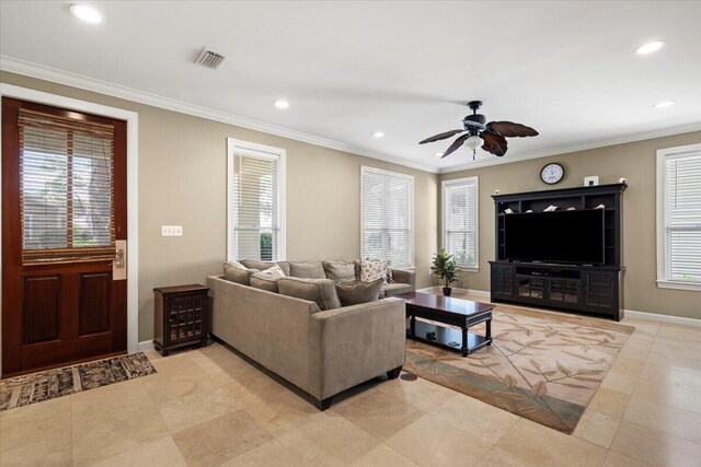 living room with ornamental molding, ceiling fan, and light tile patterned floors