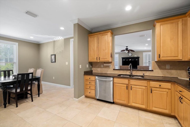 kitchen featuring tasteful backsplash, sink, ornamental molding, ceiling fan, and stainless steel dishwasher