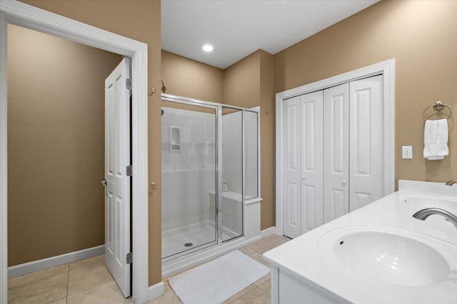 bathroom featuring vanity, tile patterned floors, and an enclosed shower