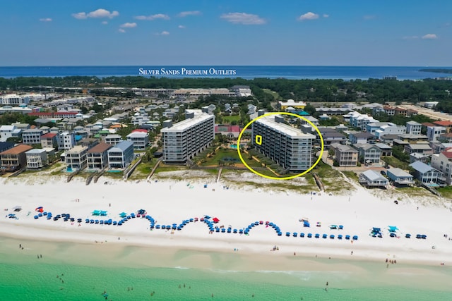 birds eye view of property with a view of the beach and a water view