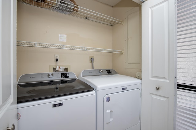 clothes washing area featuring washing machine and clothes dryer