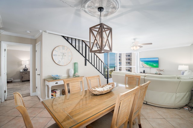 114 Main Sail Dr Unit 137, Miramar Beach, FL 32550 - dining space featuring stairway, light tile patterned floors, a ceiling fan, crown molding, and baseboards