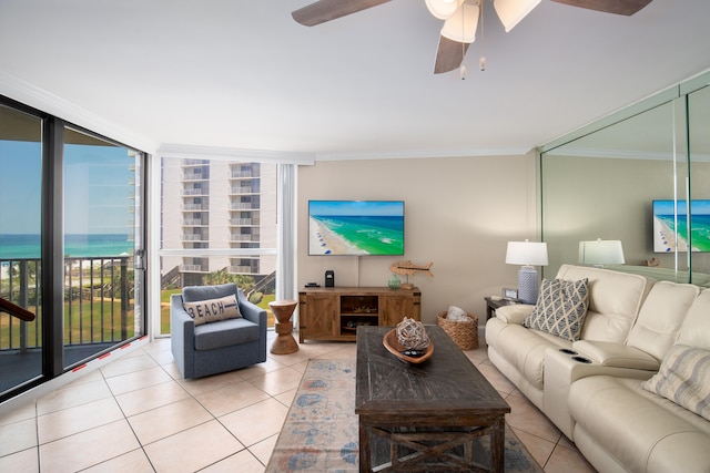 living room featuring crown molding, a water view, floor to ceiling windows, and ceiling fan