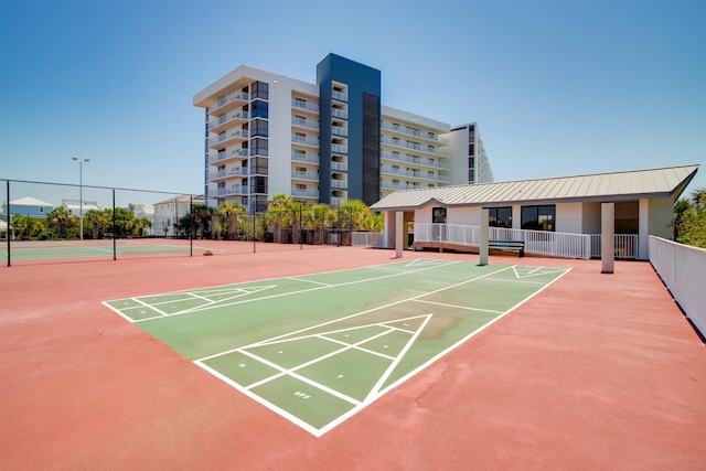 surrounding community featuring tennis court