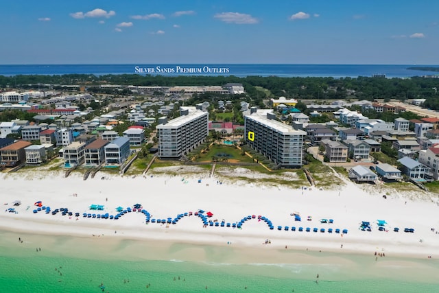 bird's eye view featuring a water view and a view of the beach