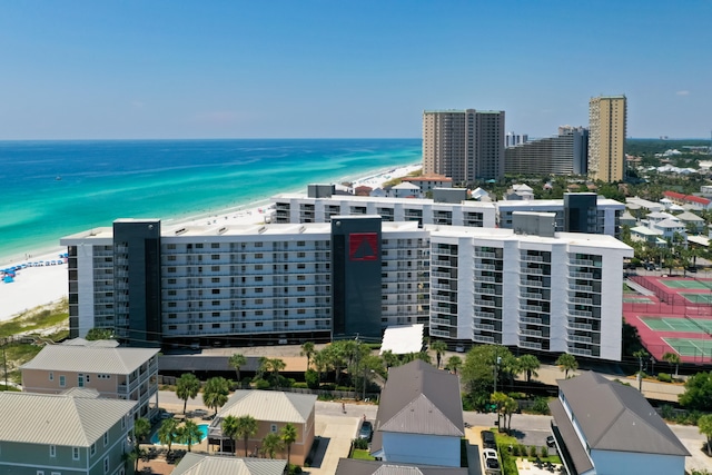 aerial view with a water view and a view of the beach