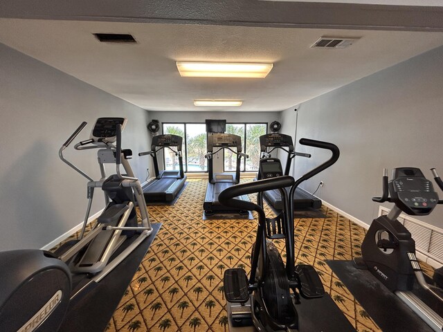 114 Main Sail Dr Unit 137, Miramar Beach, FL 32550 - exercise room with carpet and baseboards
