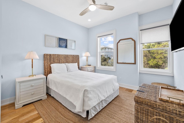 bedroom featuring light wood-type flooring and ceiling fan