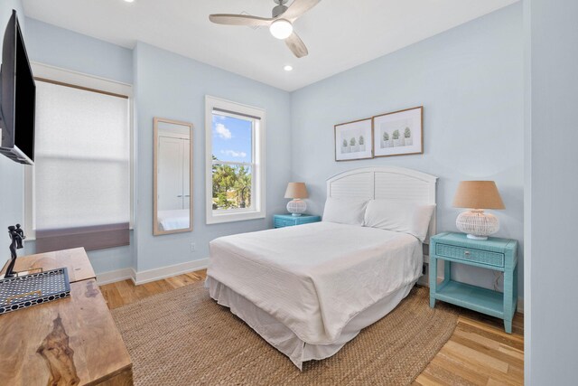 bedroom featuring light hardwood / wood-style floors and ceiling fan