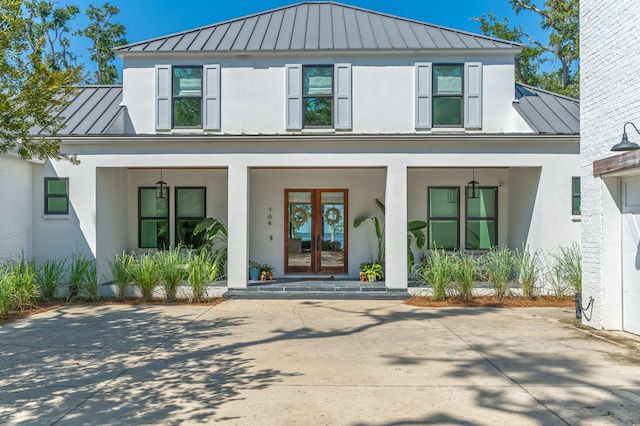 view of front facade featuring a porch and french doors