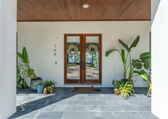 entrance to property featuring a patio area and french doors