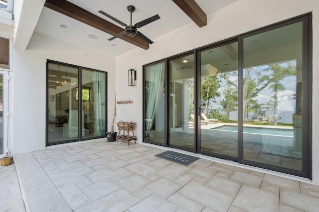 view of patio featuring ceiling fan