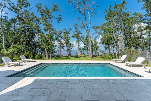 view of pool featuring a lawn and a patio