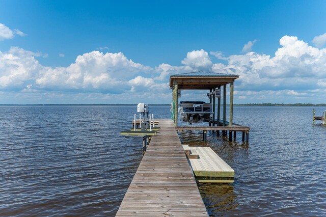 view of dock with a water view