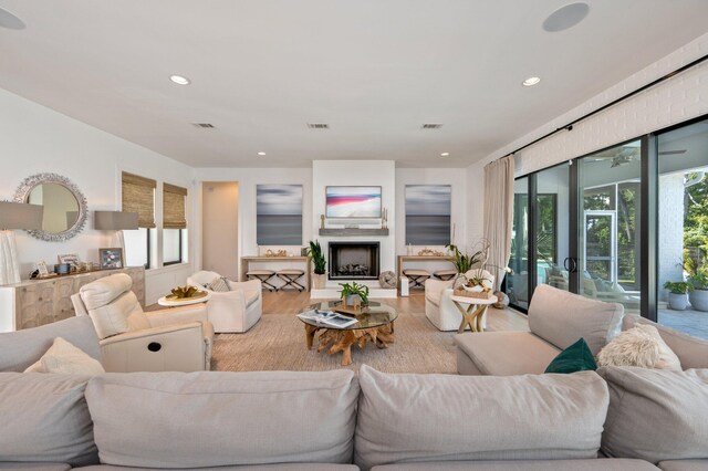 living room with a wealth of natural light and wood-type flooring