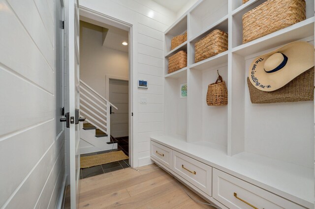 mudroom with light hardwood / wood-style floors