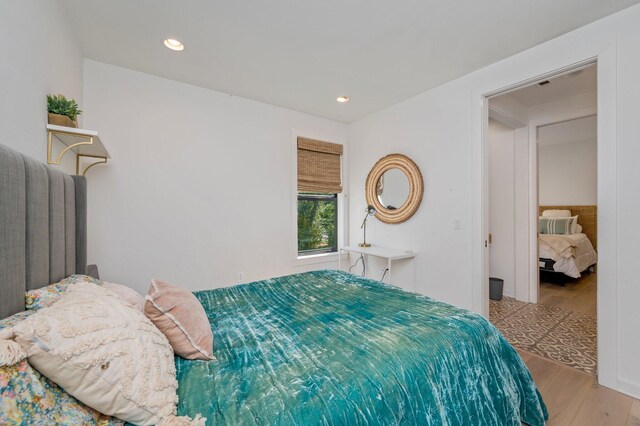 bedroom with light hardwood / wood-style flooring