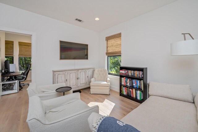 living room with light hardwood / wood-style flooring