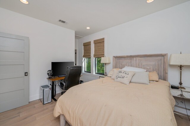 bedroom with light hardwood / wood-style flooring