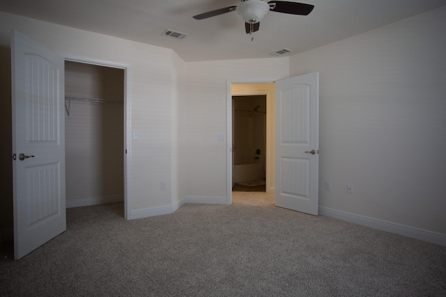 unfurnished bedroom featuring a closet, light carpet, and ceiling fan