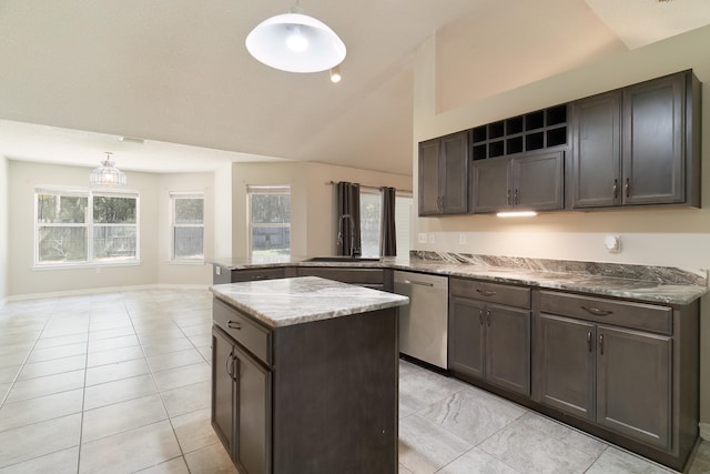 kitchen featuring hanging light fixtures, a wealth of natural light, lofted ceiling, and dishwasher