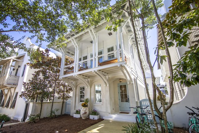 view of front of property with a balcony