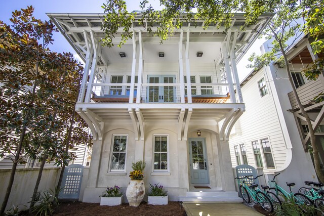 view of front of home with a balcony