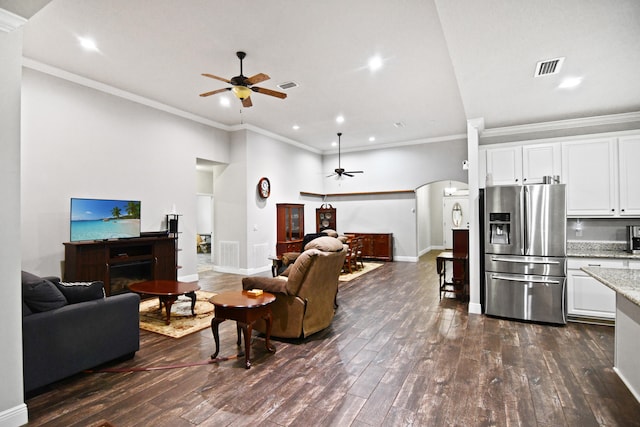 living room with ceiling fan and dark hardwood / wood-style floors