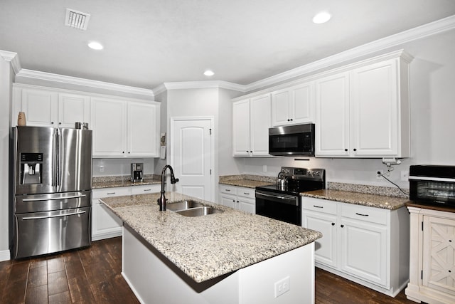 kitchen featuring stainless steel fridge, a center island with sink, white cabinetry, and electric range