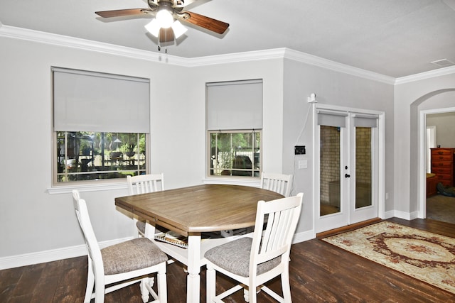 dining room featuring ceiling fan, dark hardwood / wood-style floors, french doors, and crown molding