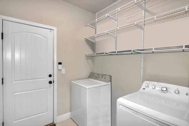 laundry area with independent washer and dryer