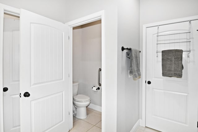 bathroom featuring tile patterned flooring and toilet