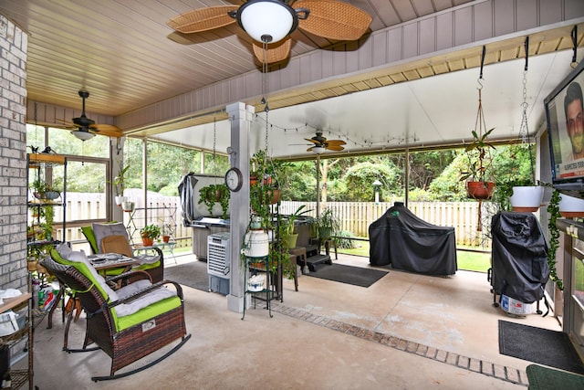 sunroom / solarium with ceiling fan and a wealth of natural light