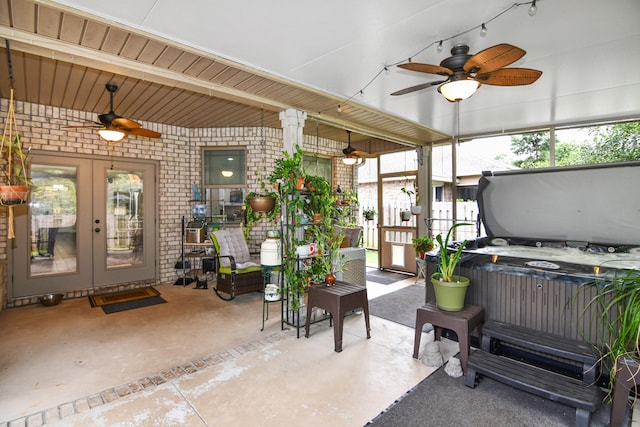 view of patio with a hot tub and ceiling fan