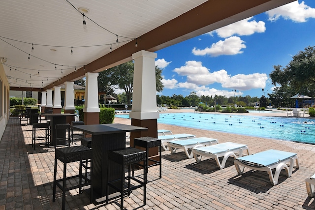 view of patio / terrace featuring a community pool